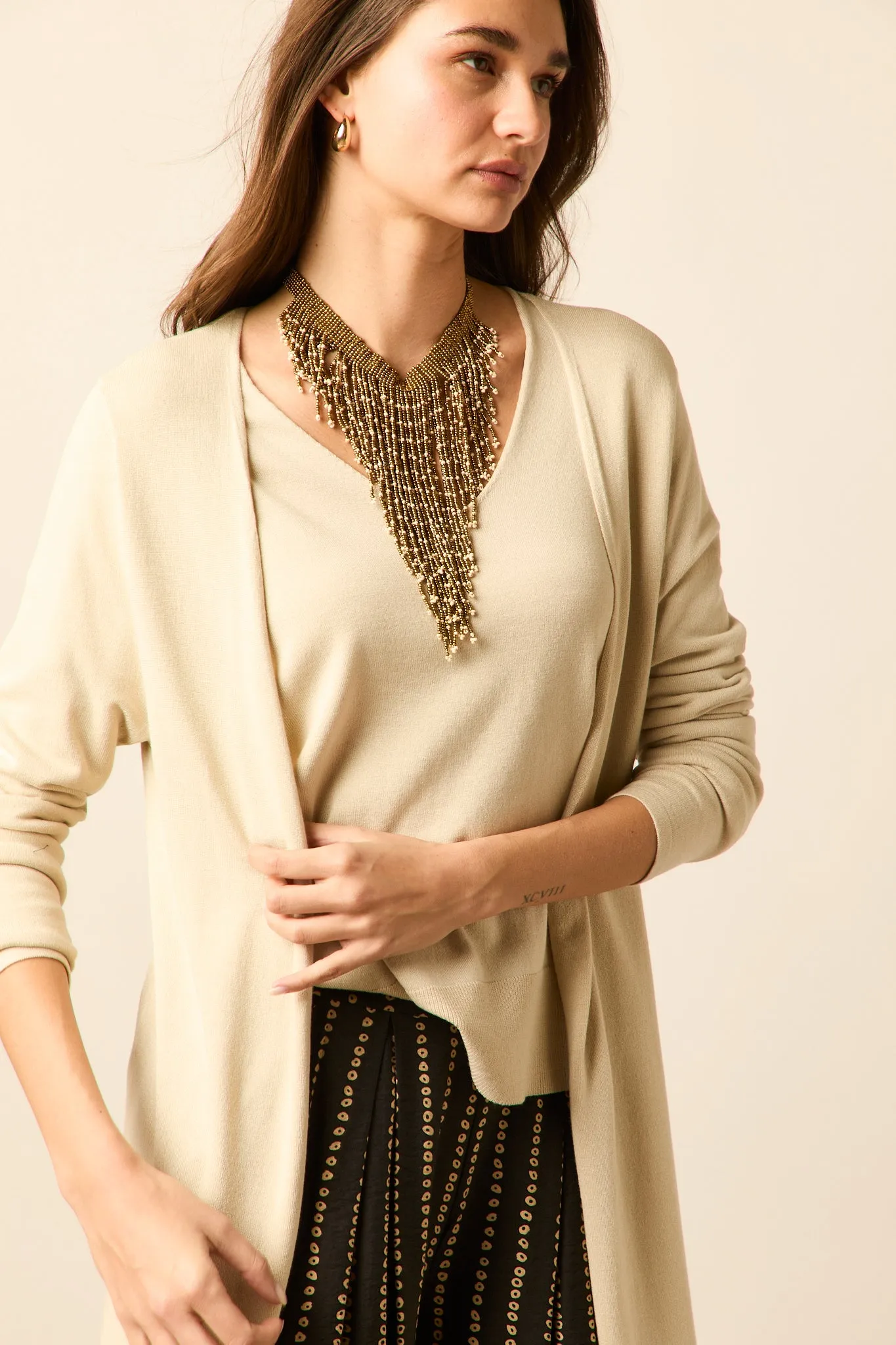 Chaqueta larga punto beige